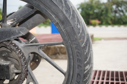 Nail in the Tire of Jo's Suzuki Raider