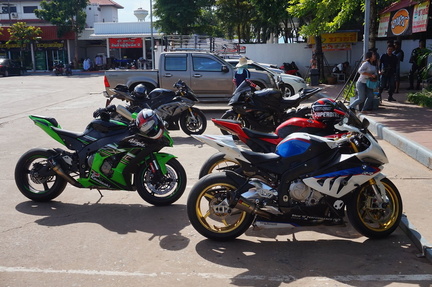 At a gas station with other bikes