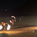 twirling sticks of fire